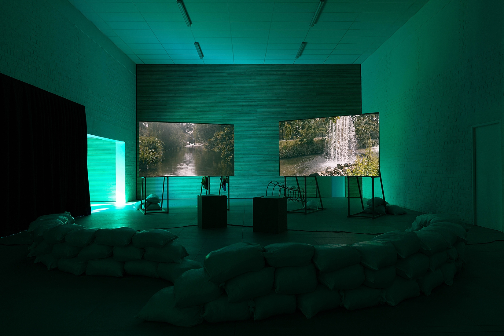 https://abrideswardt.com/files/gimgs/th-81_Installation view Abri de Swardt, Kammakamma (2022-2024), Synchronised two-channel projection, configurable screens, sand from Macassar Dunes, and costumes, 16’54 min 3.jpg